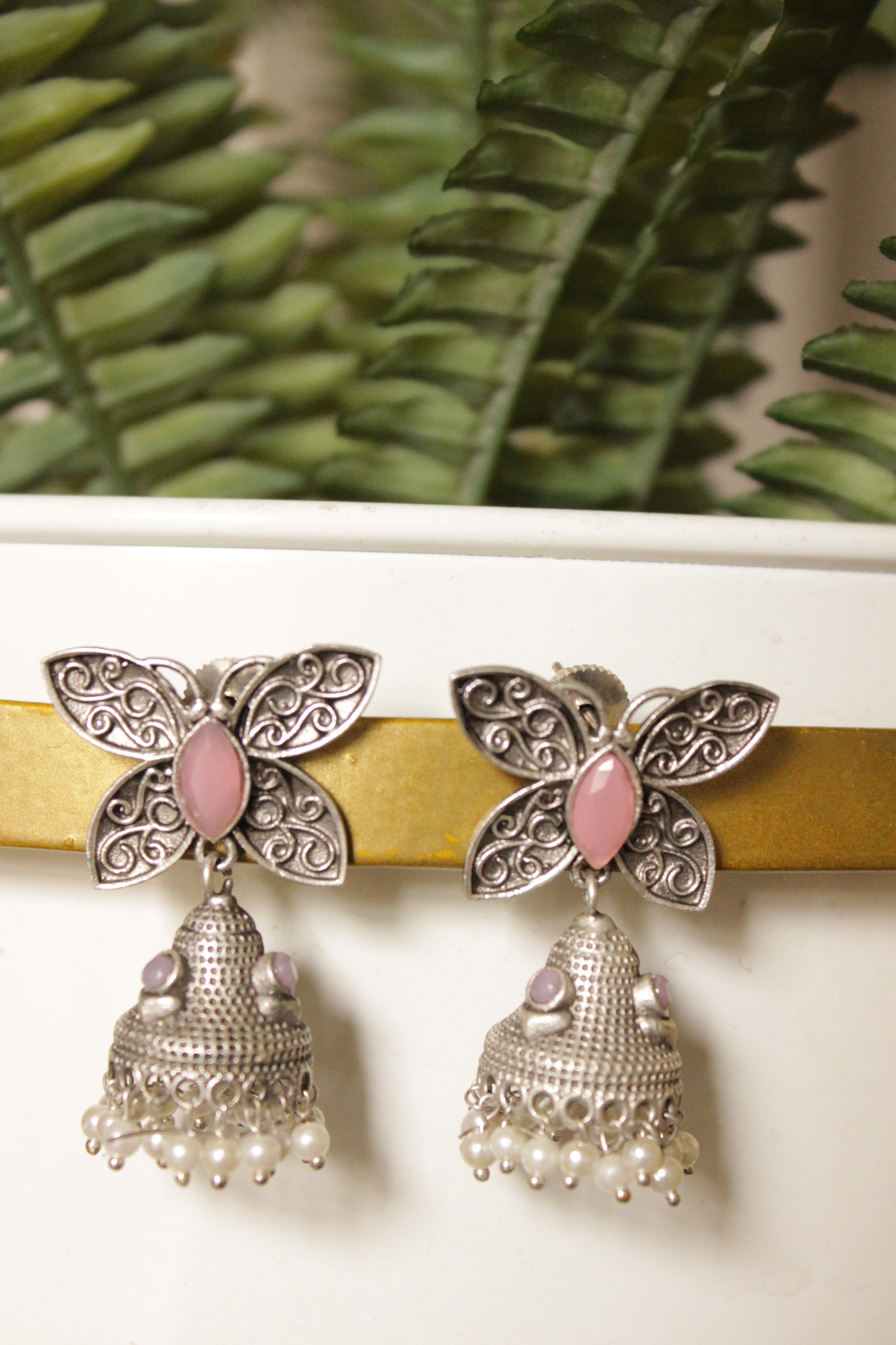 Pink Center Stone Silver Finish Butterfly Brass Jhumka Earrings