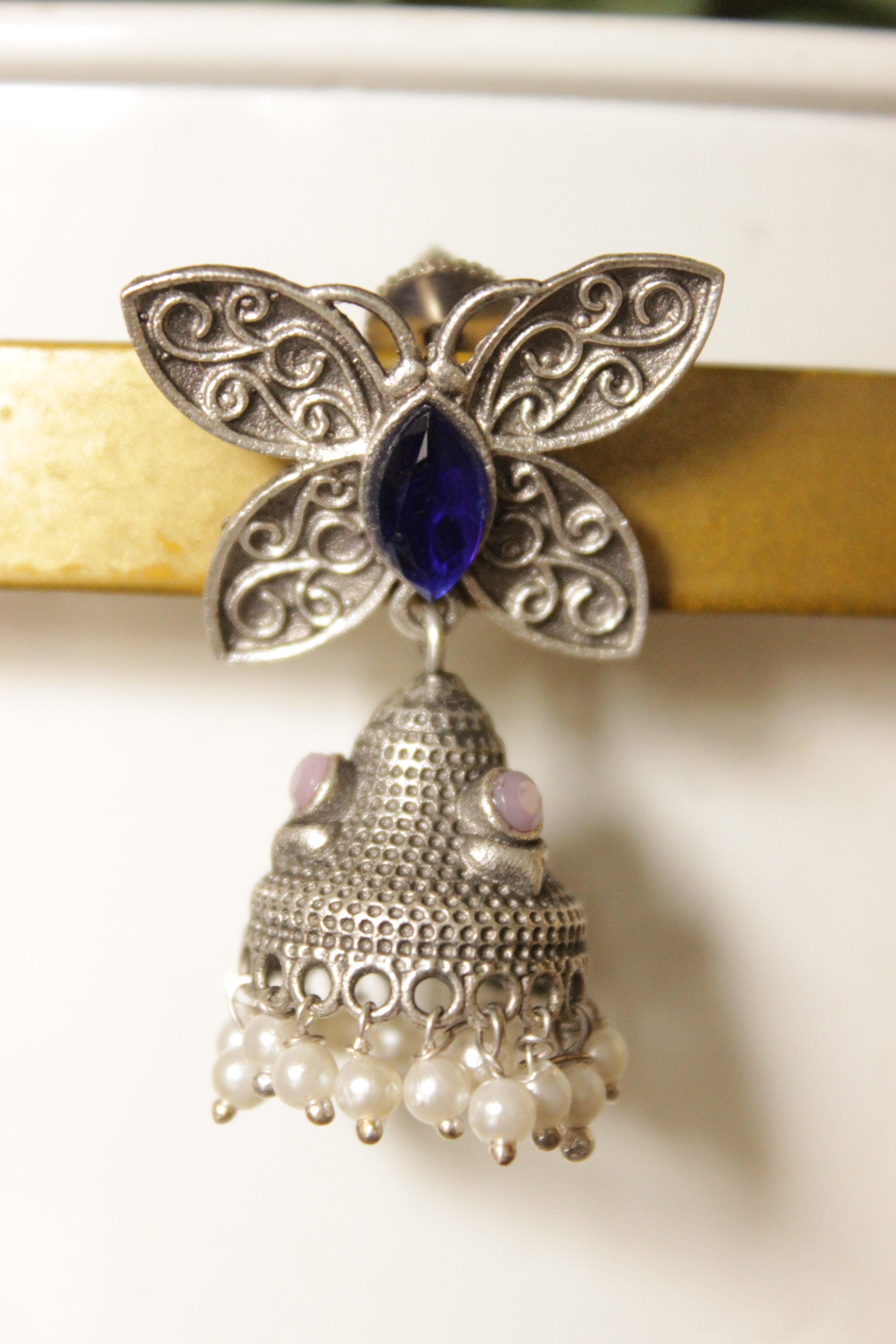 Purple Center Stone Silver Finish Butterfly Brass Jhumka Earrings