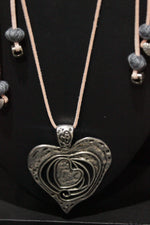 Load image into Gallery viewer, Oxidised Silver Finish Heart Shaped Pendant Rope Closure Necklace Set with Metal Accents
