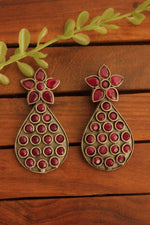Load image into Gallery viewer, Oxidised Finish Flower Motif Teardrop Earrings Embedded with Ruby Red Stones
