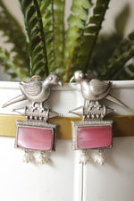 Load image into Gallery viewer, Peacock Motif Pink Glass Stone Embedded Silver Finish Brass Dangler Earrings
