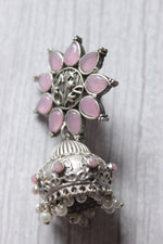 Load image into Gallery viewer, Baby Pink Glass Stones Embedded Silver Finish Flower Motif Dangler Jhumka Earrings in Brass
