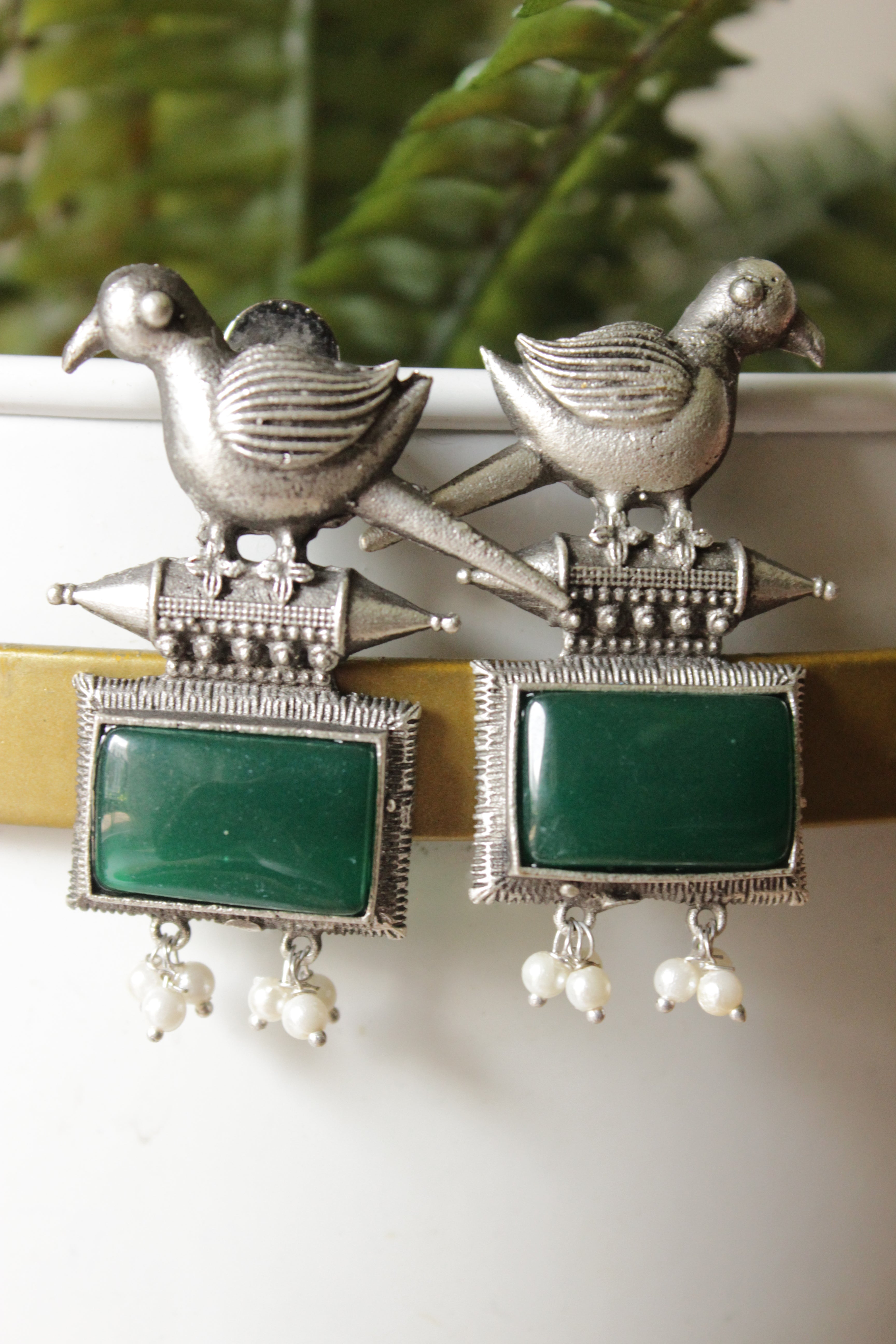 Peacock Motif Bottle Green Glass Stone Embedded Silver Finish Brass Dangler Earrings
