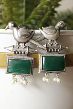 Load image into Gallery viewer, Peacock Motif Bottle Green Glass Stone Embedded Silver Finish Brass Dangler Earrings
