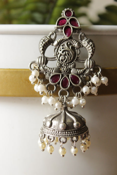 Intricately Detailed Red Glass Stones Embedded Brass Statement Dangler Earrings Accentuated with White Beads