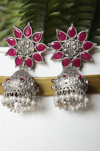 Bridal Plum Glass Stones Embedded Silver Finish Flower Motif Dangler Jhumka Earrings in Brass