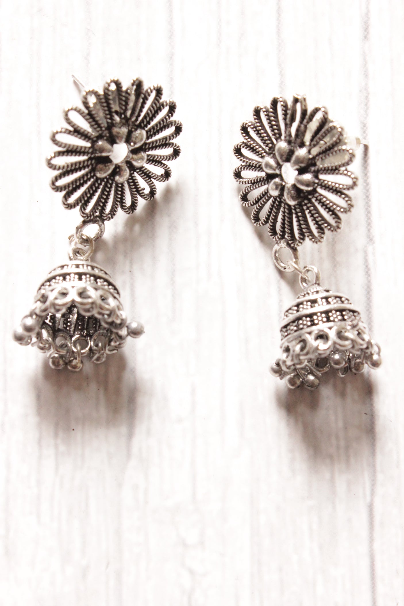 Flower Motif Oxidised Silver Finish Jhumka Earrings