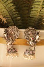 Load image into Gallery viewer, Pink Stones Embedded Silver Finish Peacock Motif Statement Dangler Earrings Accentuated with White Beads
