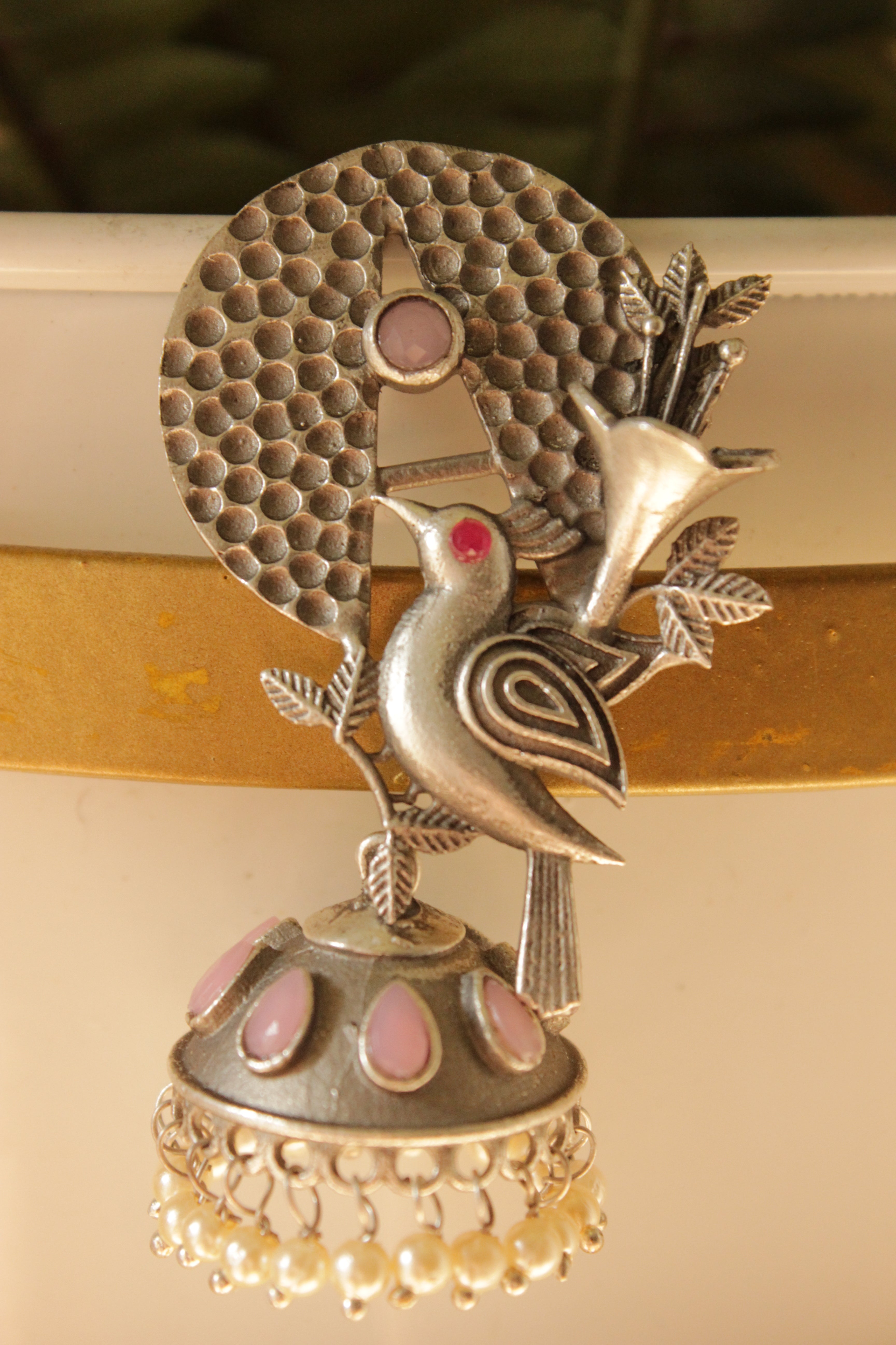Pink Stones Embedded Silver Finish Peacock Motif Statement Dangler Earrings Accentuated with White Beads