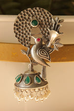 Load image into Gallery viewer, Green Stones Embedded Silver Finish Peacock Motif Statement Dangler Earrings Accentuated with White Beads
