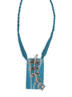 Load image into Gallery viewer, Ikat Printed Fabric Necklace Set with Metal Leaves Detailing
