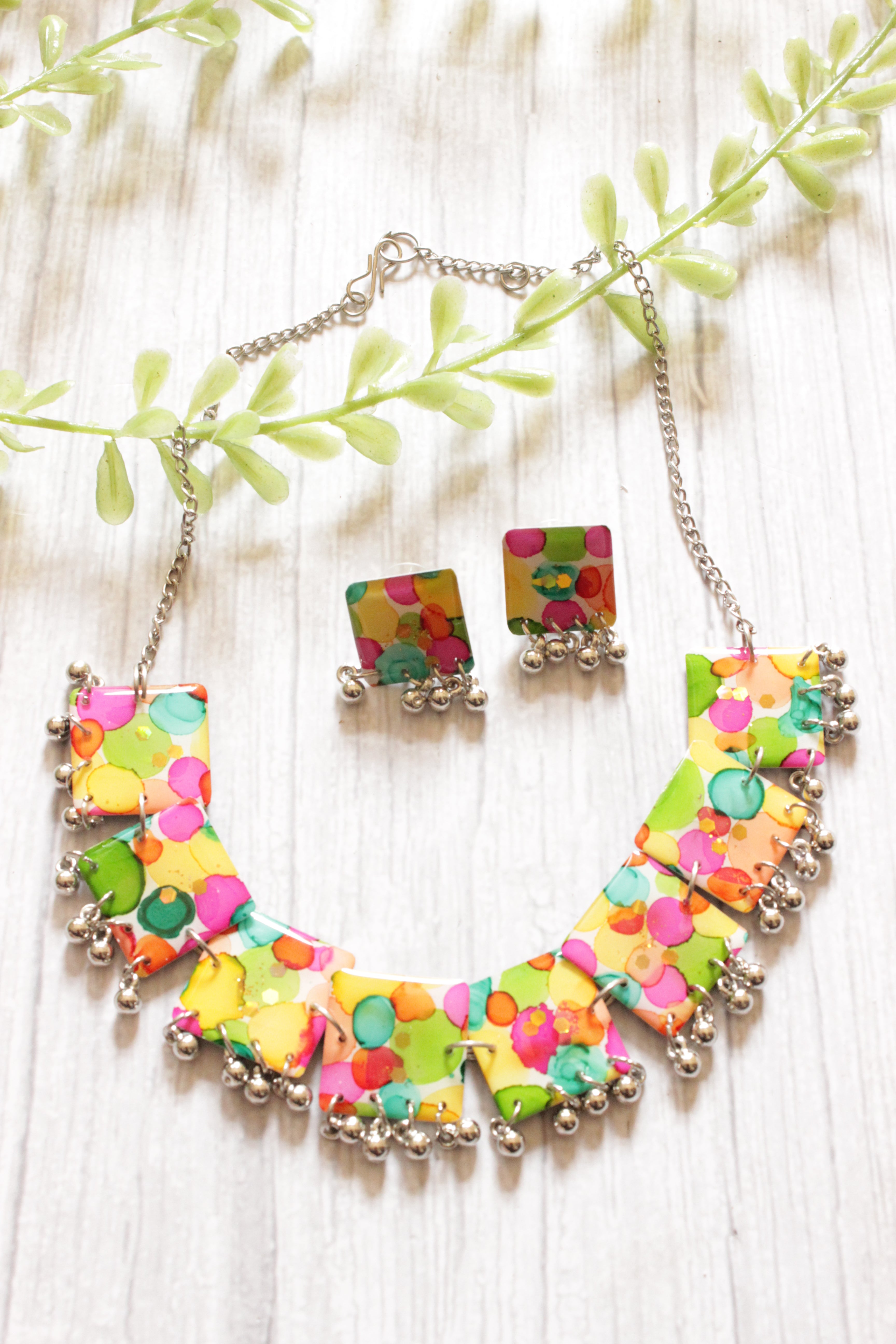 Multi-Color Resin Necklace Set Embellished with Ghungroo Beads Accents and comes with Stud Earrings