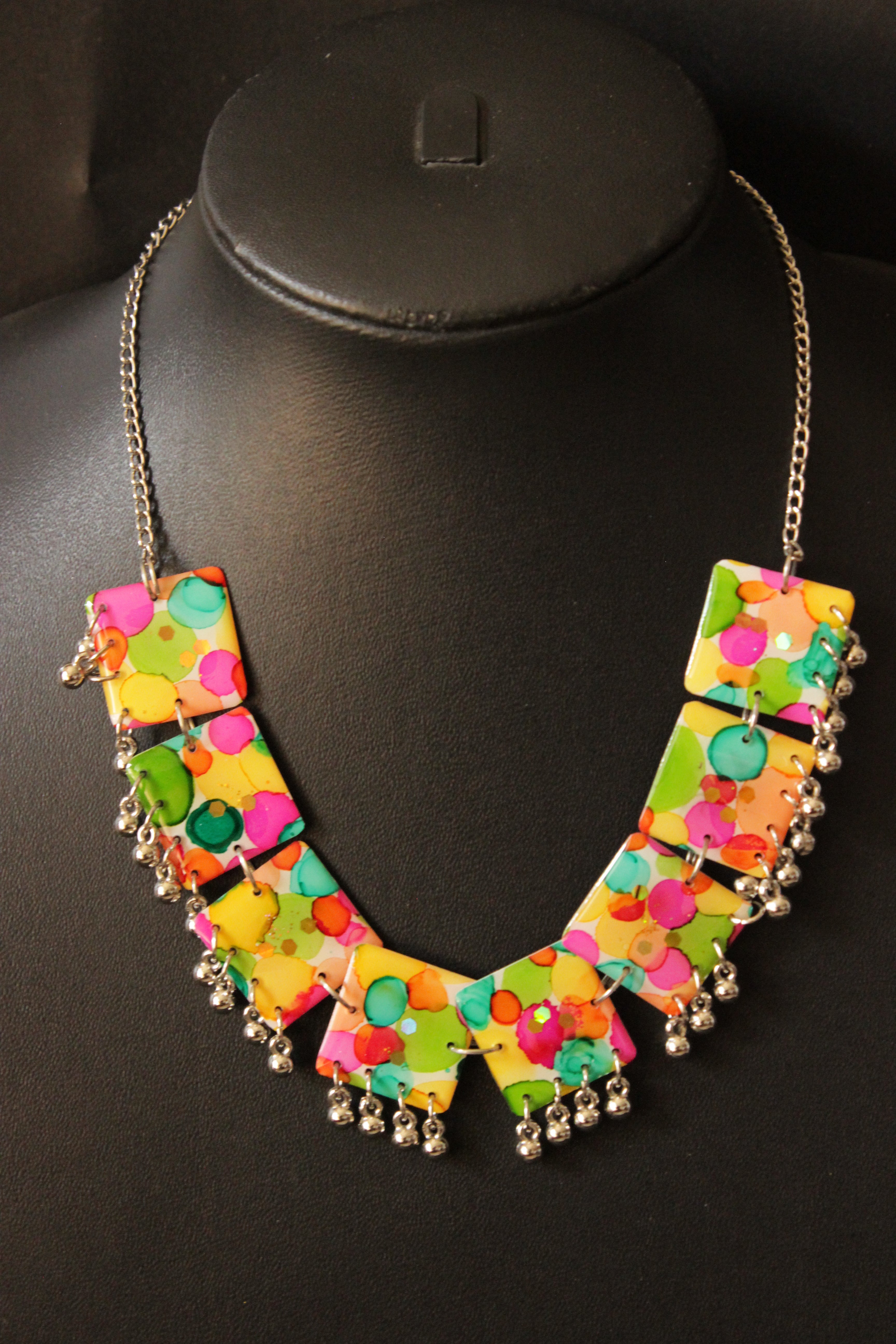 Multi-Color Resin Necklace Set Embellished with Ghungroo Beads Accents and comes with Stud Earrings