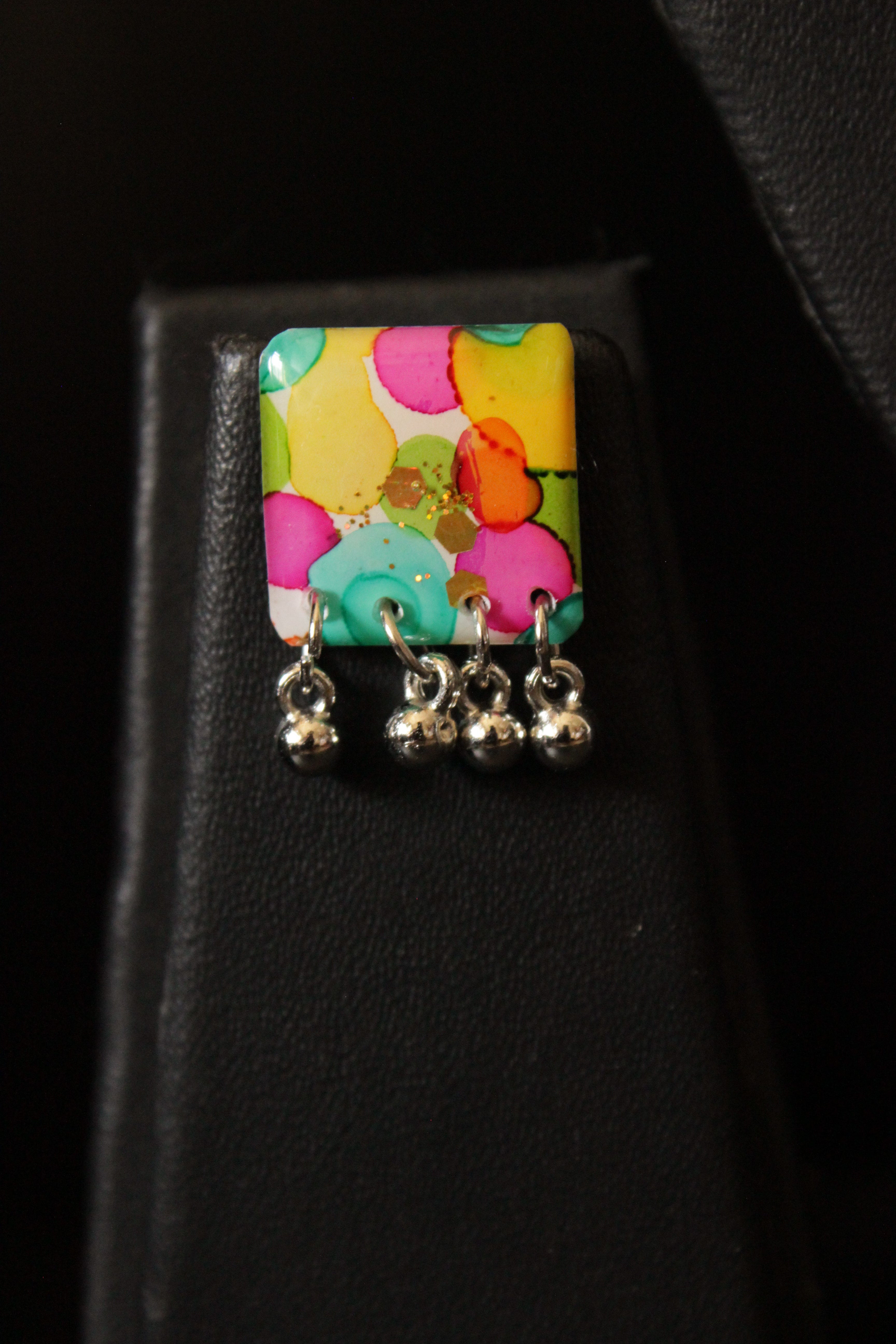 Multi-Color Resin Necklace Set Embellished with Ghungroo Beads Accents and comes with Stud Earrings