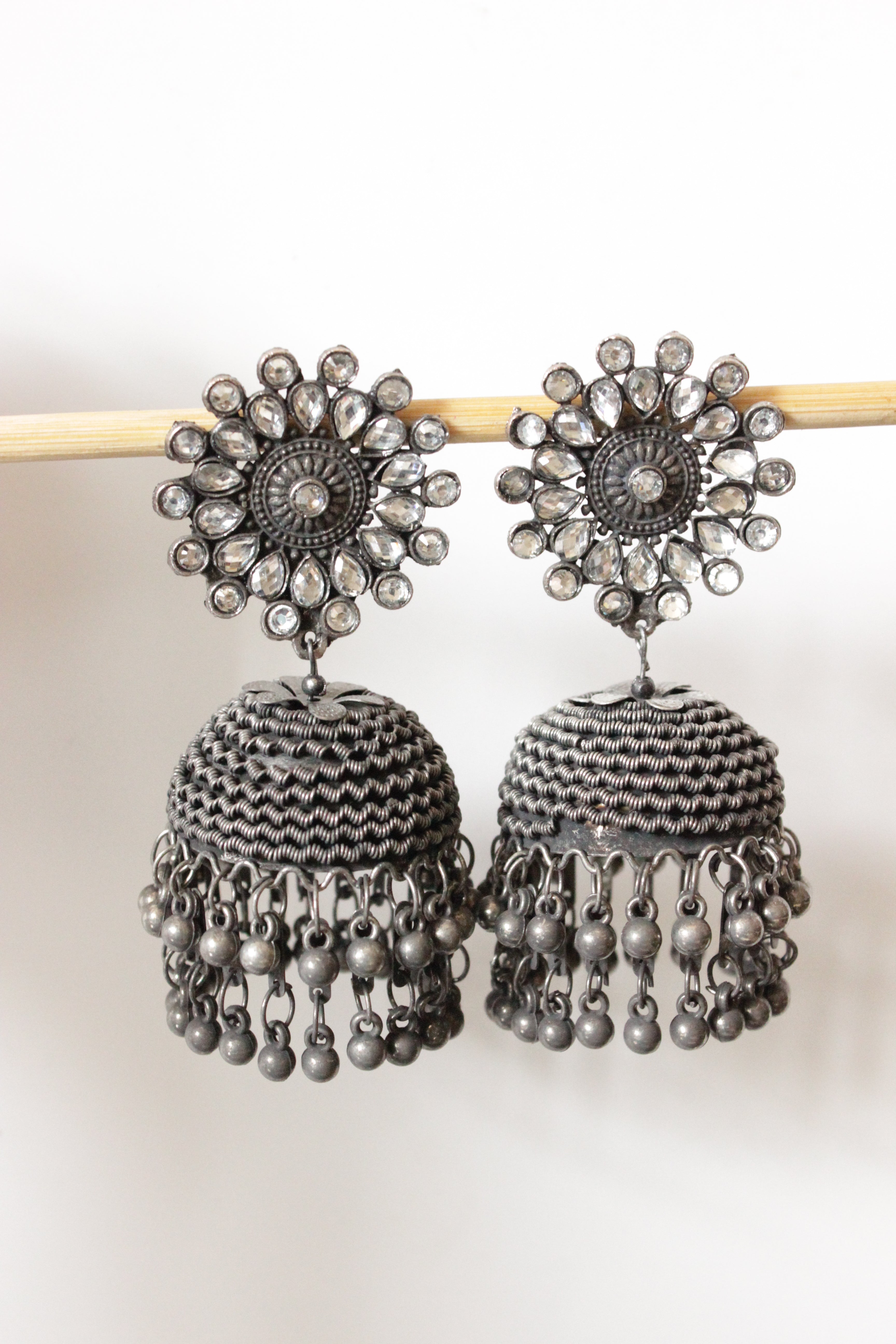 White Glass Stones Embedded Oxidised Finish Jhumkas with Bead Strings