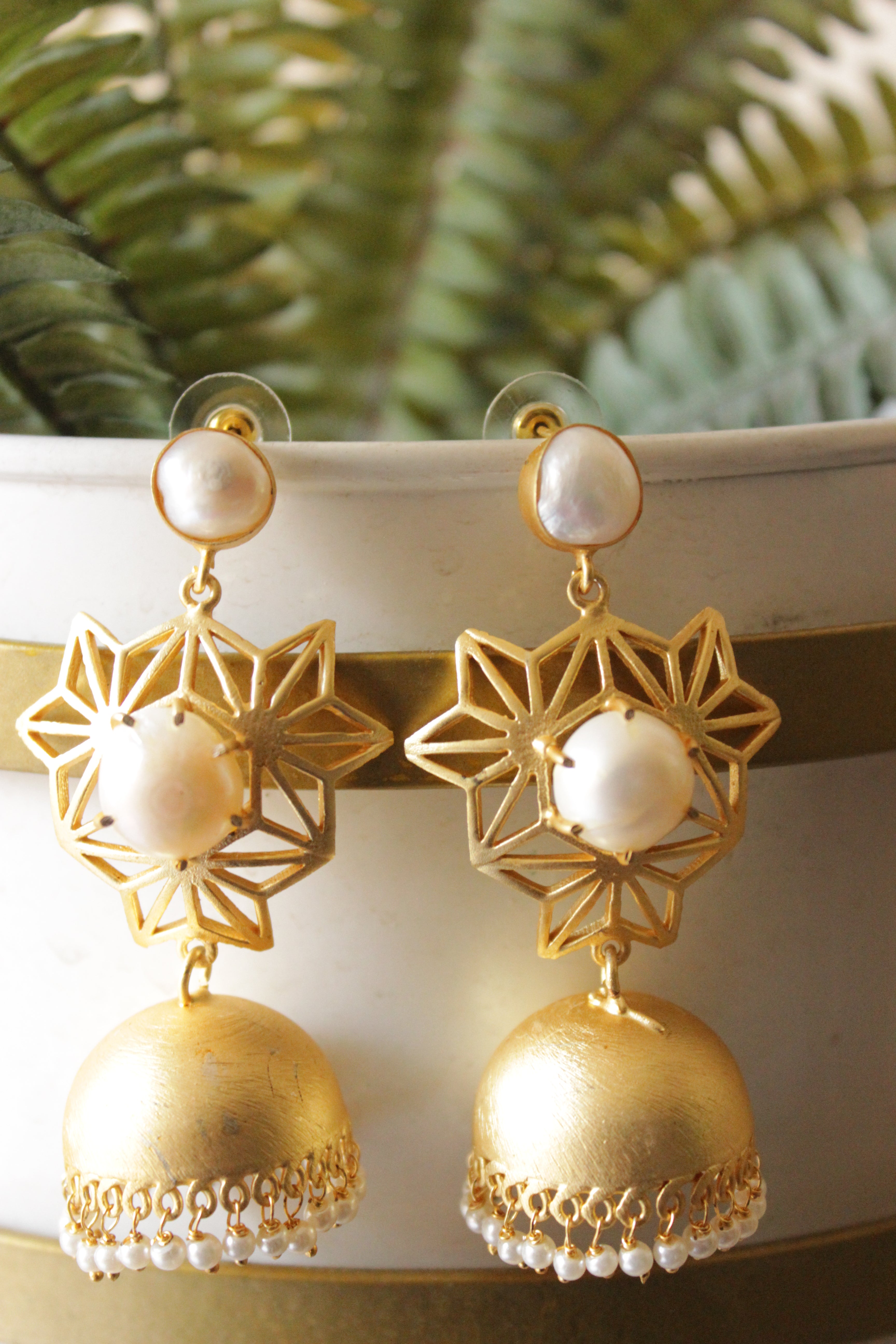 Outstanding River Pearl Natural Gemstone Embedded Gold Plated Intricately Detailed Jhumka Earrings