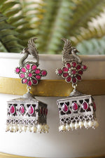 Load image into Gallery viewer, Ruby Pink Glass Stones Embedded Premium Oxidised Finish Peacock Motif Square Jhumka Earrings
