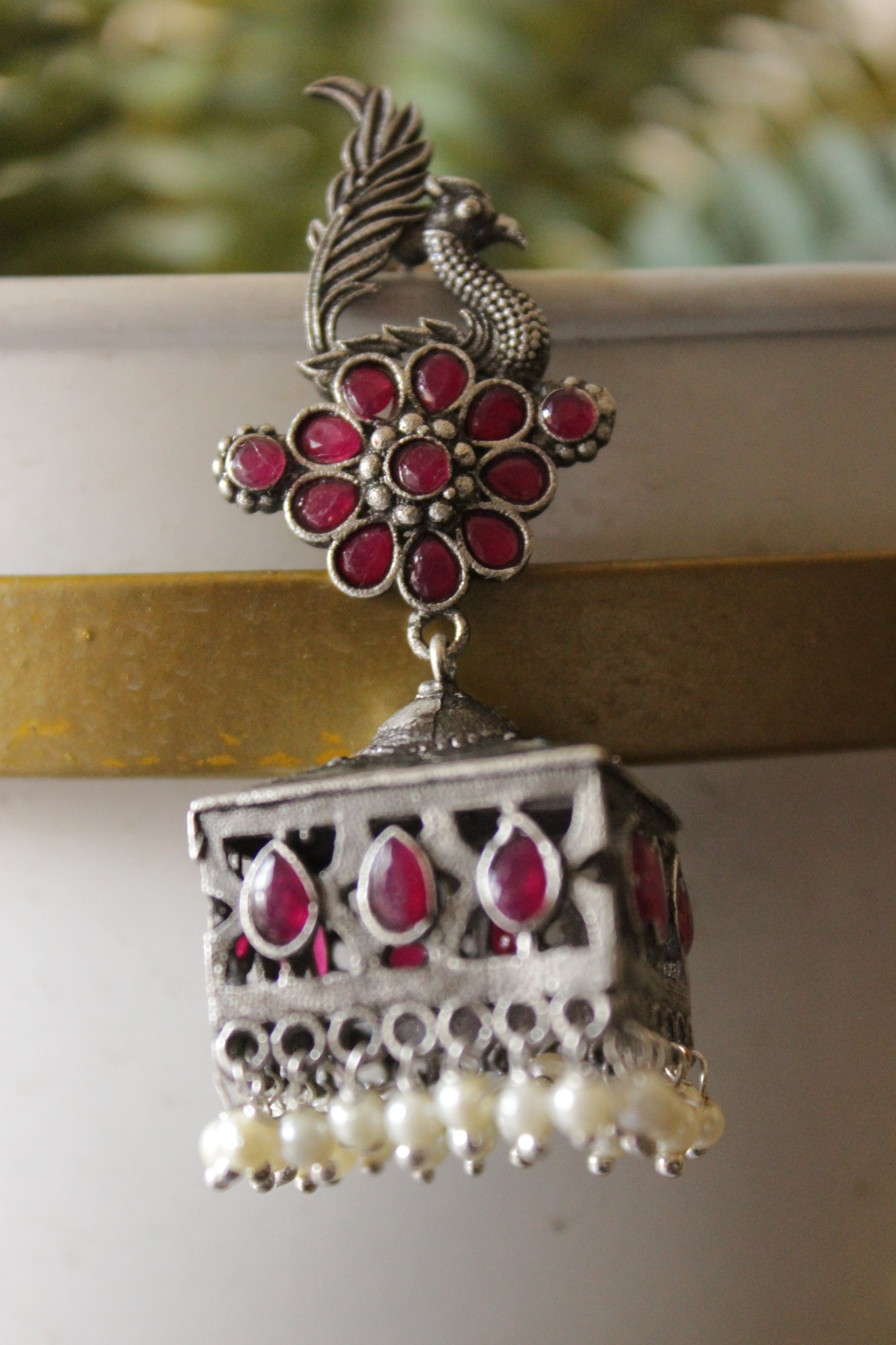 Ruby Pink Glass Stones Embedded Premium Oxidised Finish Peacock Motif Square Jhumka Earrings