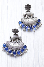 Load image into Gallery viewer, Blue Glass Stones Embedded Premium Oxidised Finish Elephant Motif Dangler Earrings
