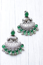 Load image into Gallery viewer, Bottle Green Glass Stones Embedded Premium Oxidised Finish Elephant Motif Dangler Earrings
