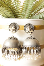 Load image into Gallery viewer, Dome Shaped Oxidised Finish Jhumka Earrings Accentuated with White Beads
